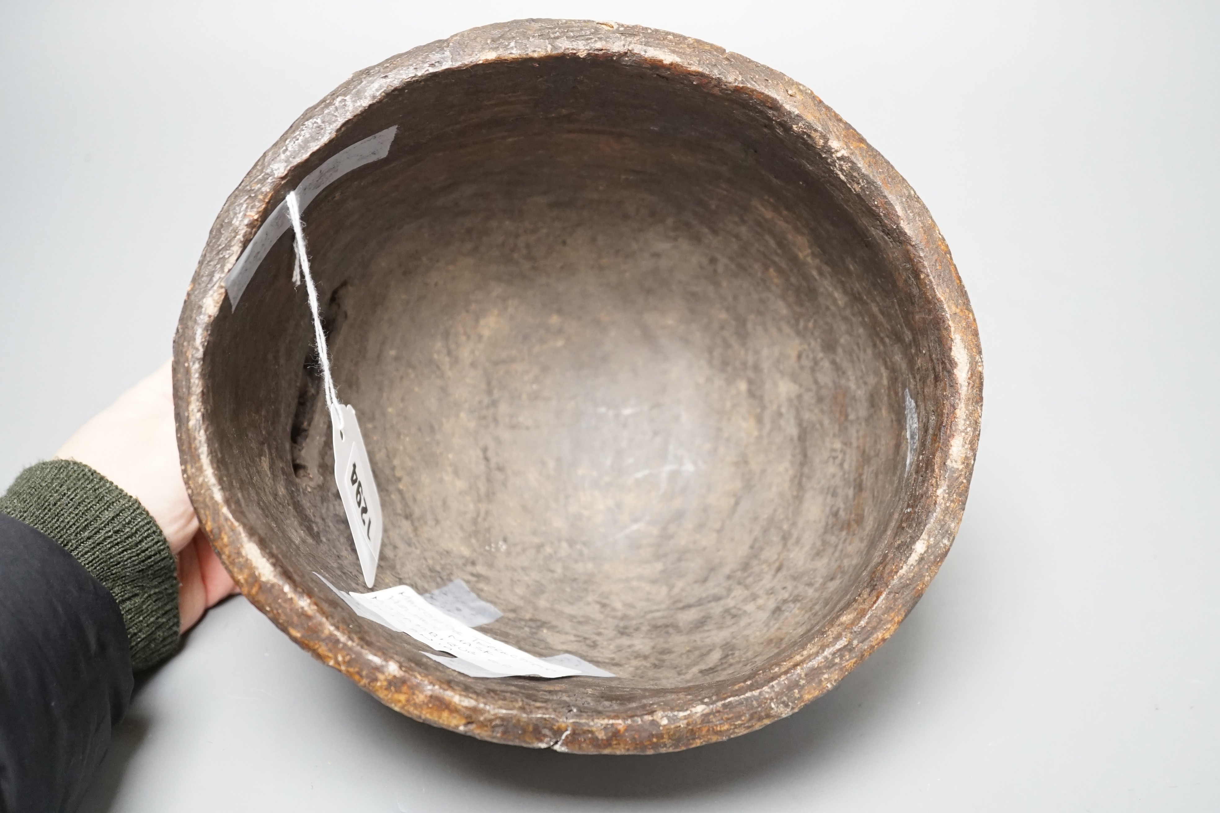 A terracotta Makonde helmet mask (Tanzanian) 21cm diameter
